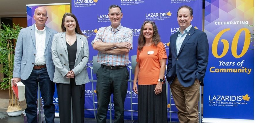 The four panellists and moderator Tarah Hodgkinson pose for a photo post-panel