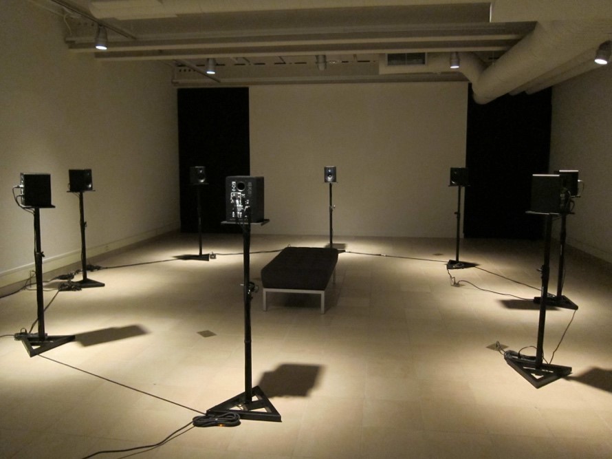 Eight speakers around a seating bench