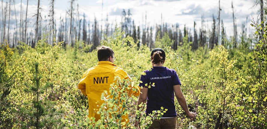 Man in NWT jacket and Jennifer Baltzer walking side by side