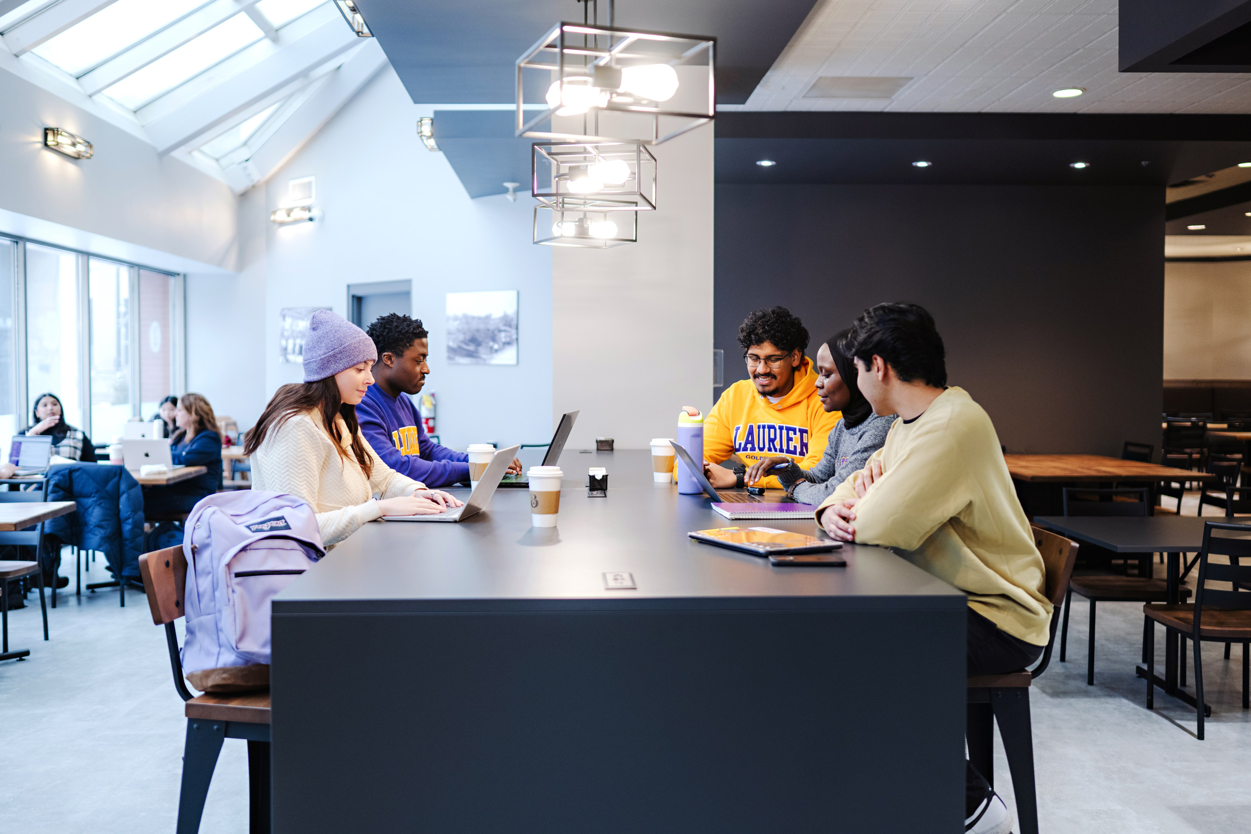 Five students studying in the Belmont Restaurant