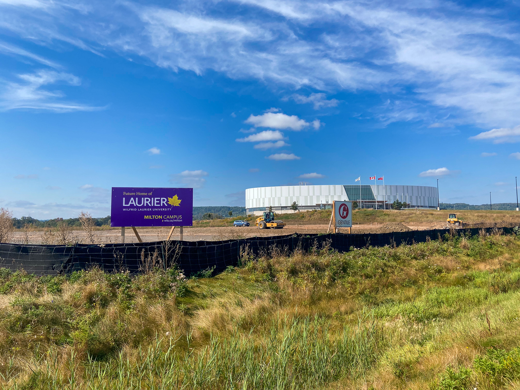 Construction site sign with earthworks.