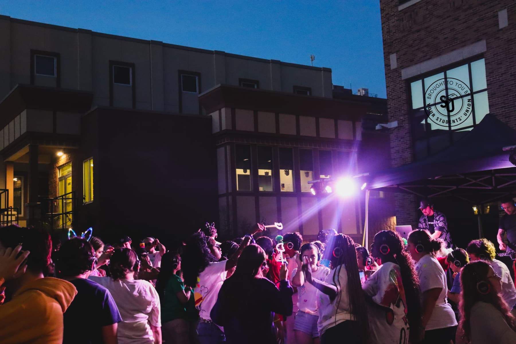 Student dancing at a headphone disco