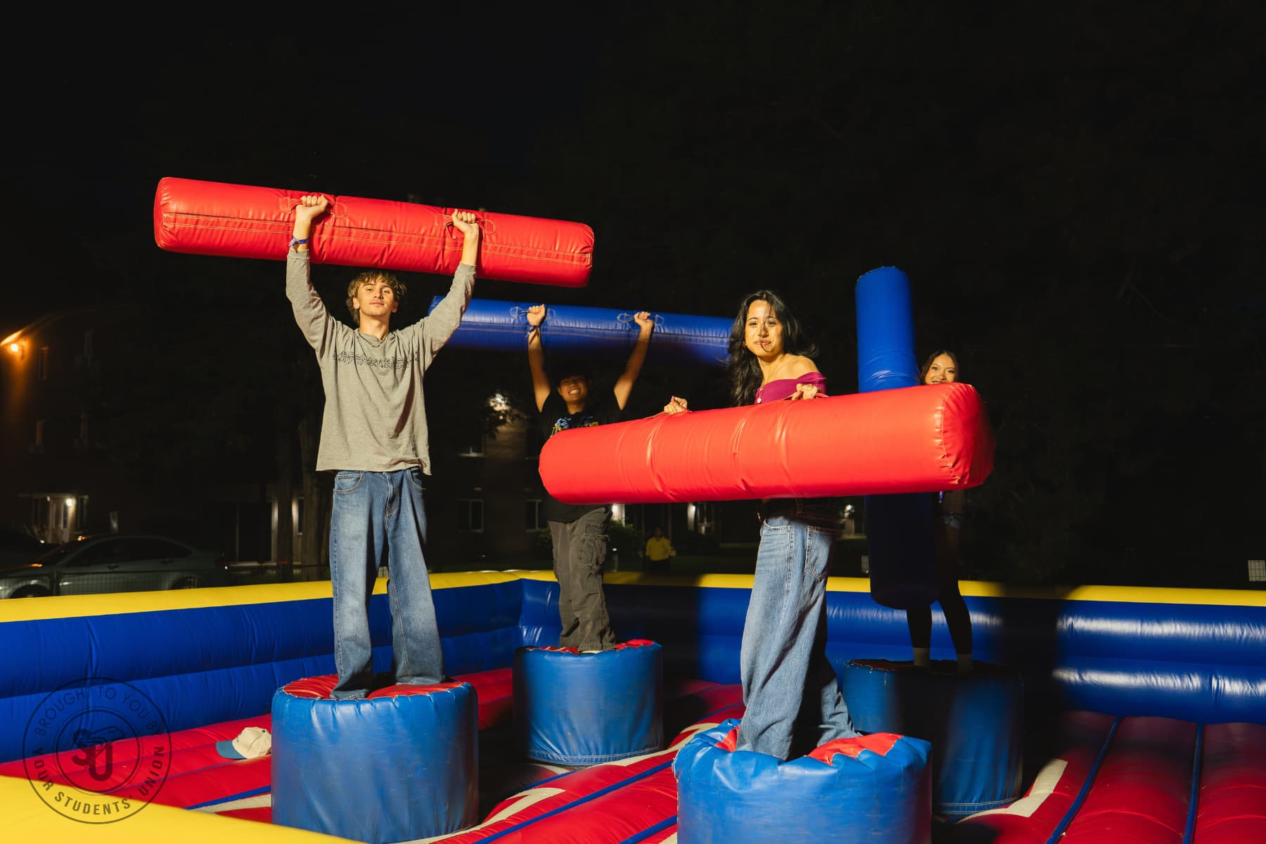 Students playing gladiator joust game