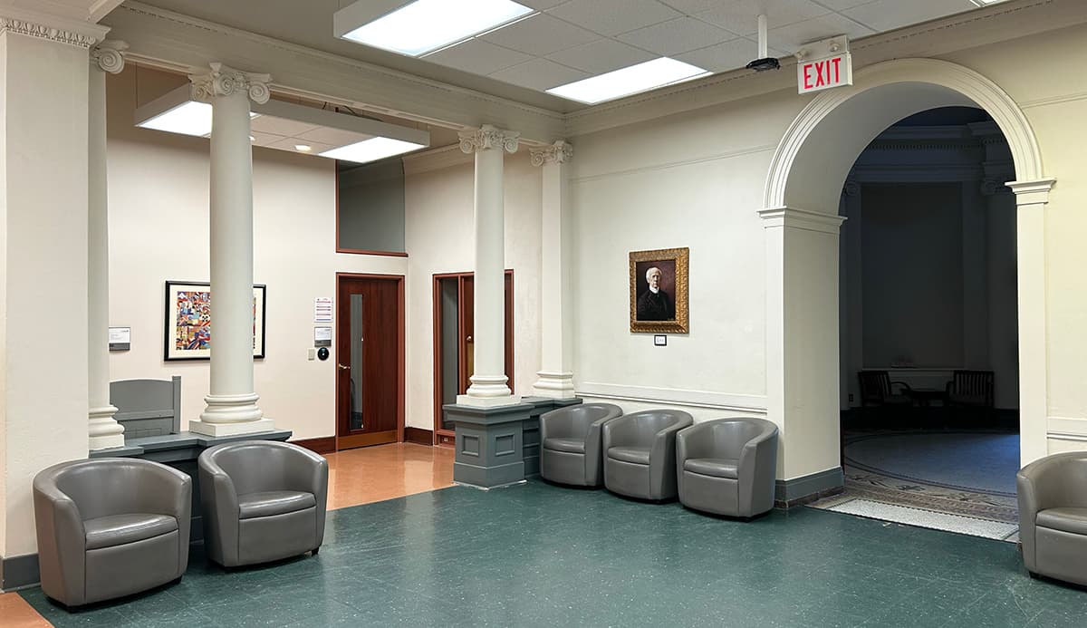 Foyer with lounge chairs lining walls