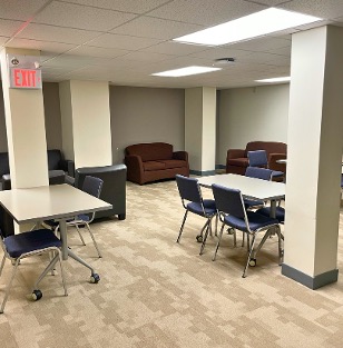 Desks and couches in between pillars