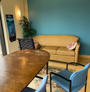 A dining table in front of a couch