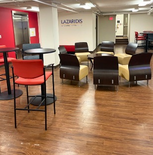 A circle of chairs around a coffee table with table seating on either side