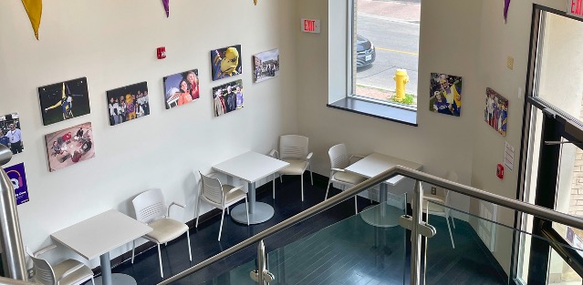 An overhead view of desks lining the walls of a corner