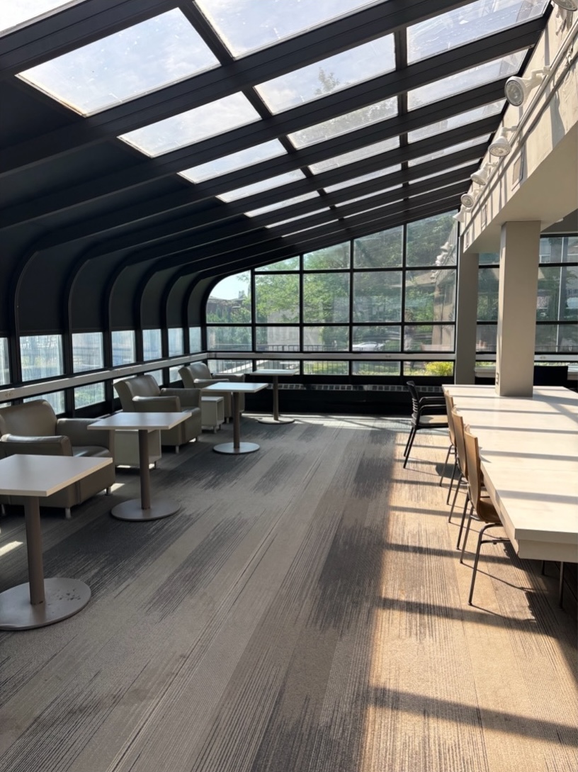 Lounge chairs facing a long table