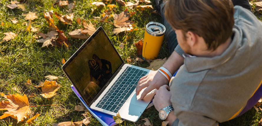 student-computer-lawn.jpg