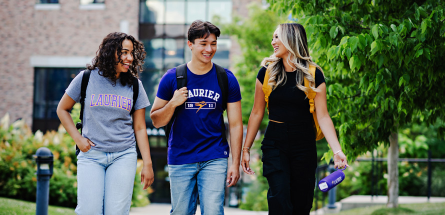 students walking outside with waterbottle in hand