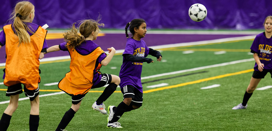 children play soccer in new dome