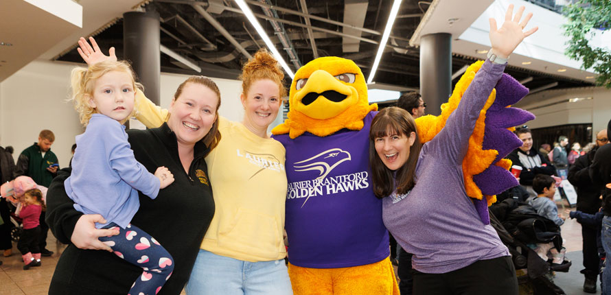 family enjoys purple and gold party