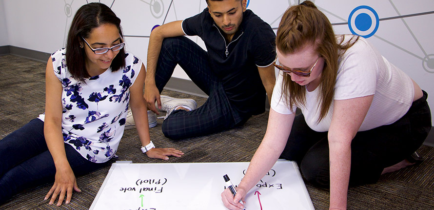 student working on whiteboard