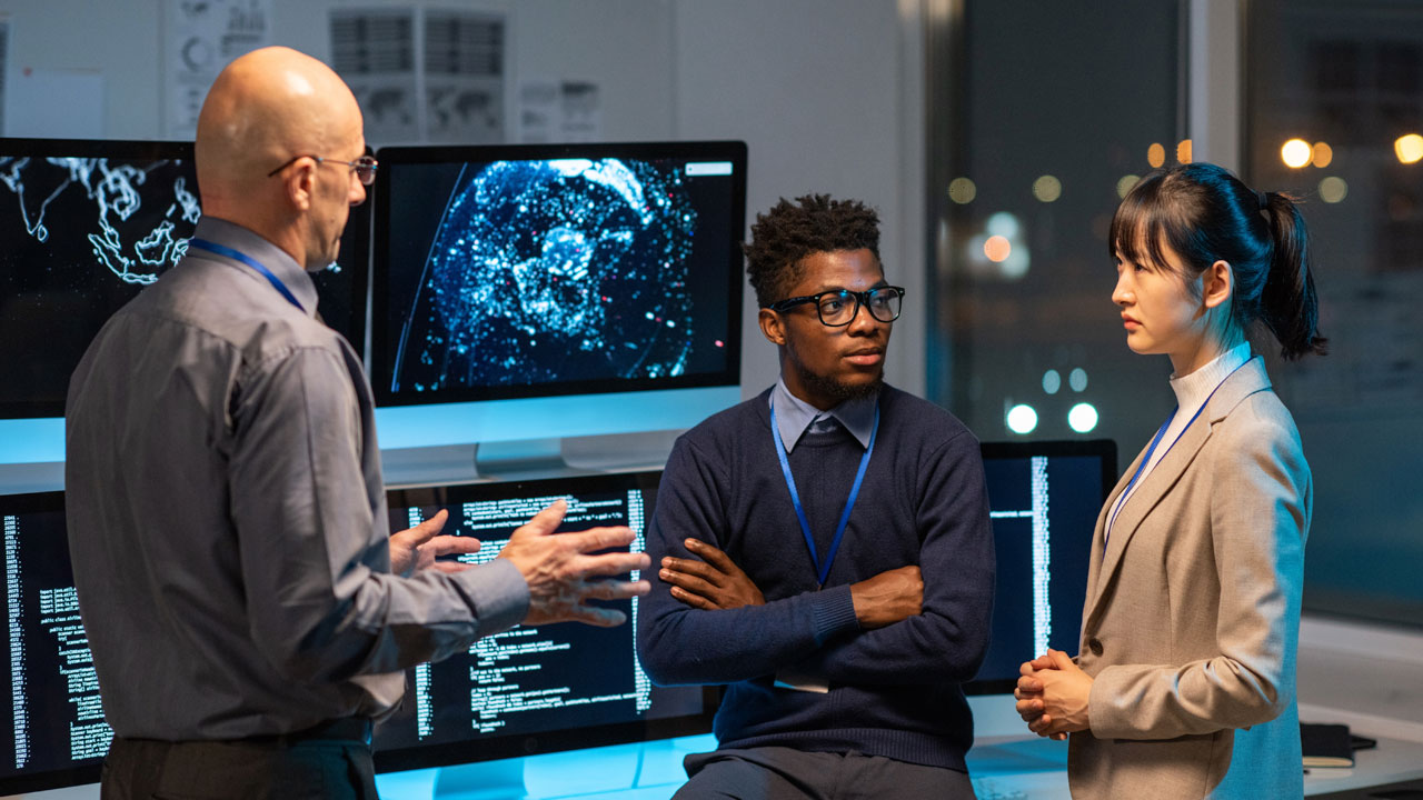 People meeting in a control room