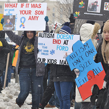 protestors holding signs