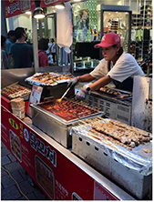 Vendor preparing street food