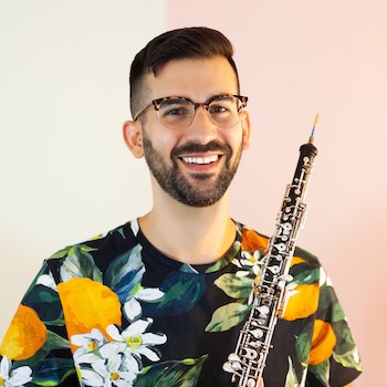 Ari holding their oboe