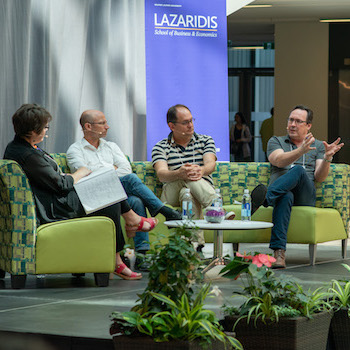 people sitting on a panel