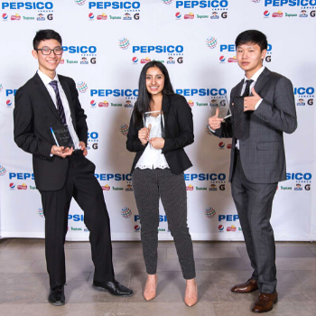 Kyle Chang, Ria Badiani and Ticoon Kim pose with their trophies