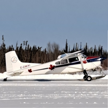 a plane sits on a snow covered plain in Samba Ke Northwest Territories