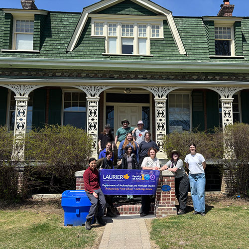 Laurier students in front of house at field school