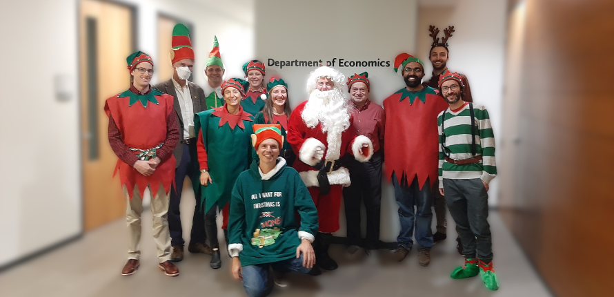 Economics faculty dressed in festive outfits