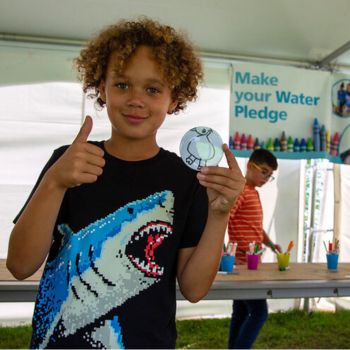 Child giving a thumbs up