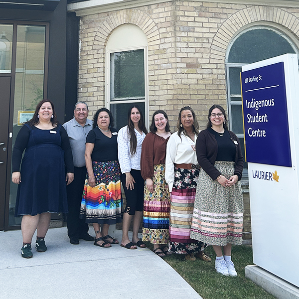 Staff stand in front of Laurier's Brantford campus Indigenous Student Centre