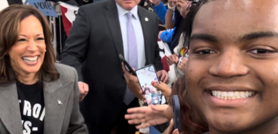 Eugene Anekwe stands with Kamala Harris