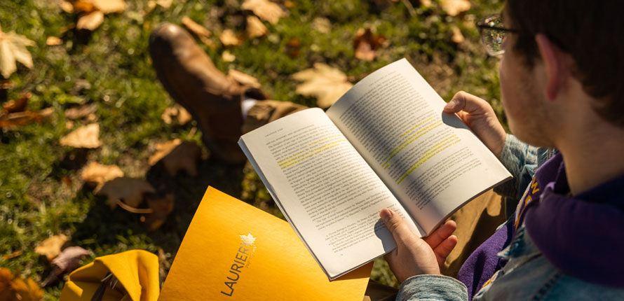 student-reading-outside.jpg