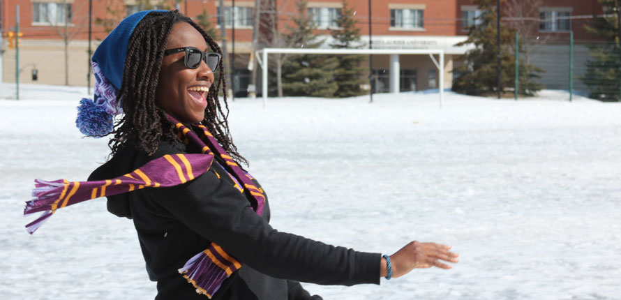 student throwing snowball