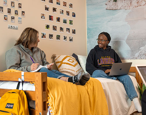 Students chatting in residence room