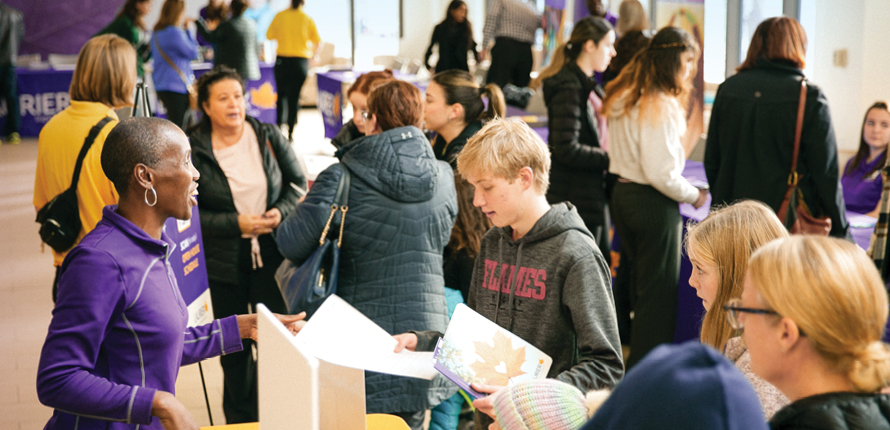 Prospective students speaking with Laurier staff.