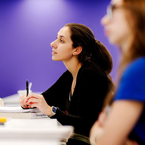 female student listening in class