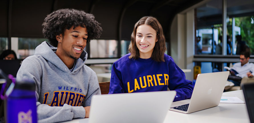 students studying in atrium