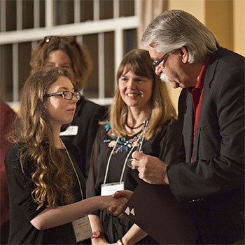 Spotlight story image pertaining to Hedidi Northwood speaking at podium