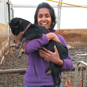 Neomi Jayaratne holding a goat