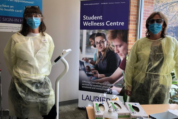 Two nurses wearing masks