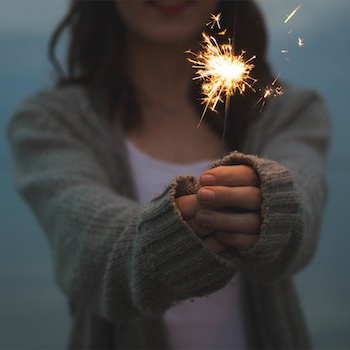 Girl holding sparkler