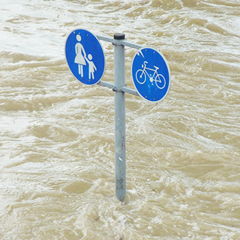 Street sign surrounded by water