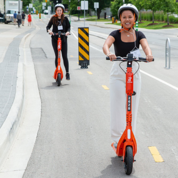 Spotlight story image pertaining to Laurier students riding e-bikes and e-scooters across campus