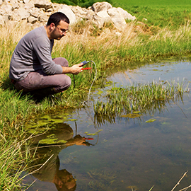 Man hovering over pond