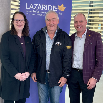 Laurier alumnus Dan Einwechter is flanked by Deborah MacLatchy, Laurier president and vice-chancellor, left, and Jason Coolman, Laurier vice-president of Advancement and External Relations.