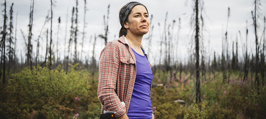 Jennifer Baltzer standing in a forest