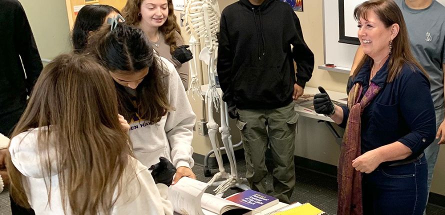 Richelle Monaghan in a classroom with Laurier students.