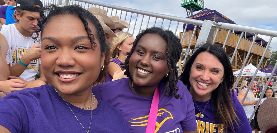 Habta, Rakotoharilala and Shadwell at a Laurier football game.