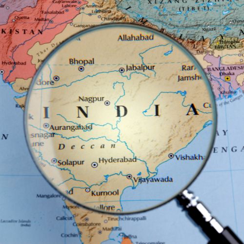 India on a map with a magnifying glass over top