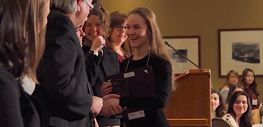 Student accepting prize at celebration