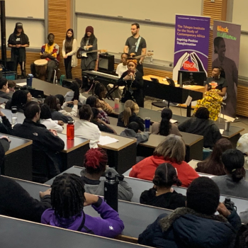 Large crowd in a lecture hall.